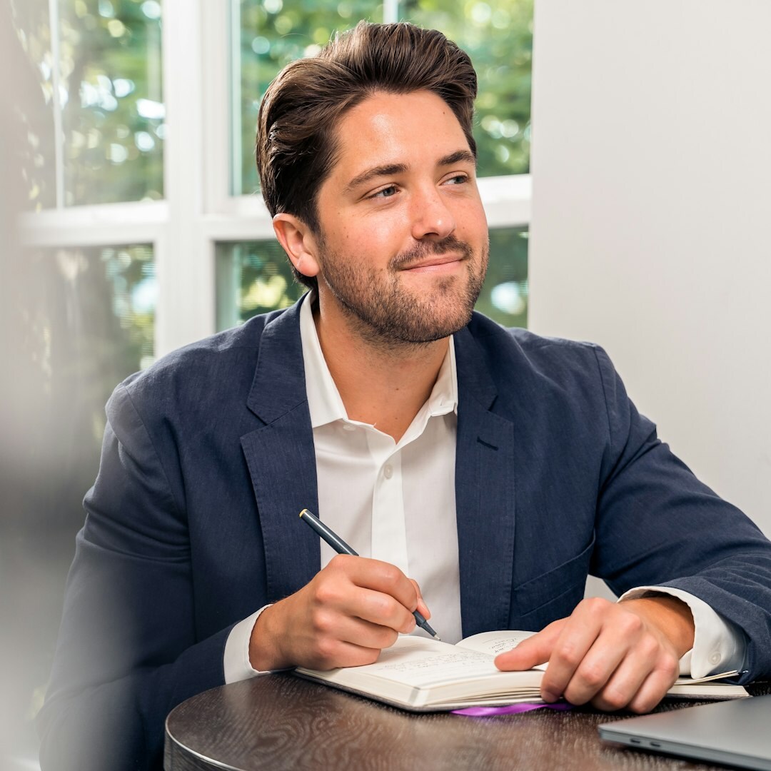 Professional man in leadership pose in modern office
