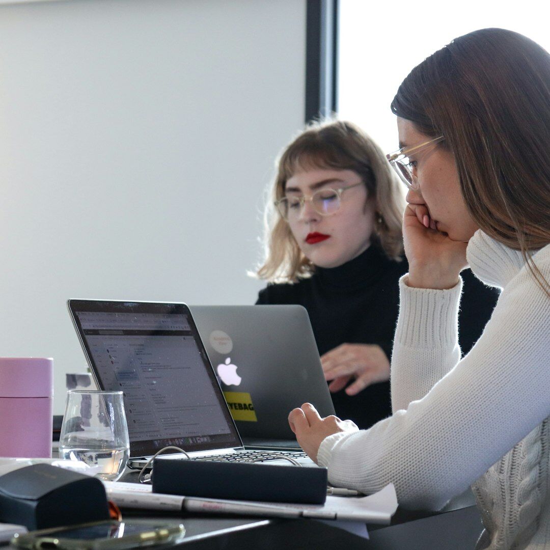 Professional woman presenting to colleagues in an office